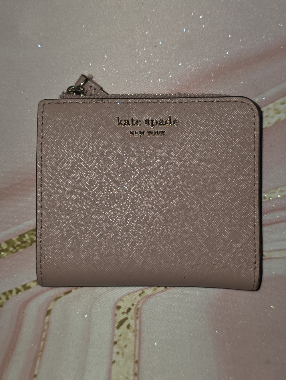 kate spade pale pink zip-around compact wallet